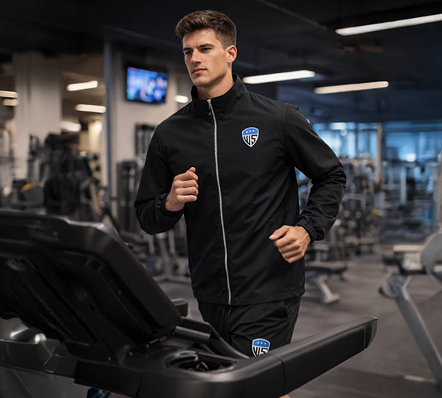 Male athlete wearing black tracksuit during outdoor running session